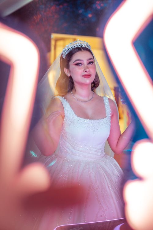 Free Stunning bride in a classic white wedding dress with a veil and tiara, captured in Baghdad, Iraq. Stock Photo