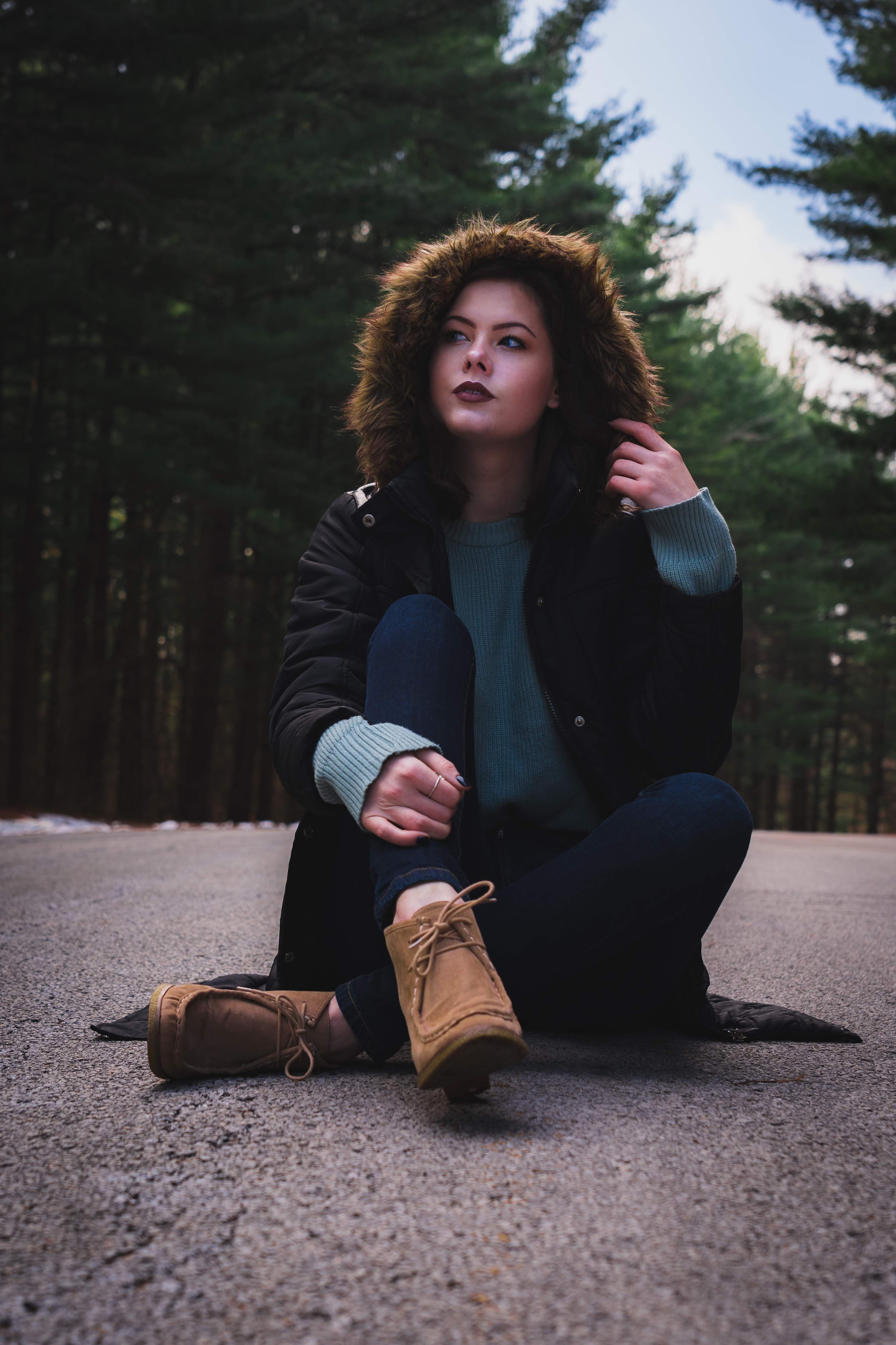 Woman Posing in a Coniferous Forest · Free Stock Photo