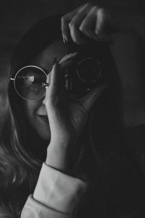 Free Monochrome Photo of Woman Using Camera Stock Photo