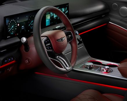 Elegant car interior featuring a modern digital dashboard and sophisticated design elements.