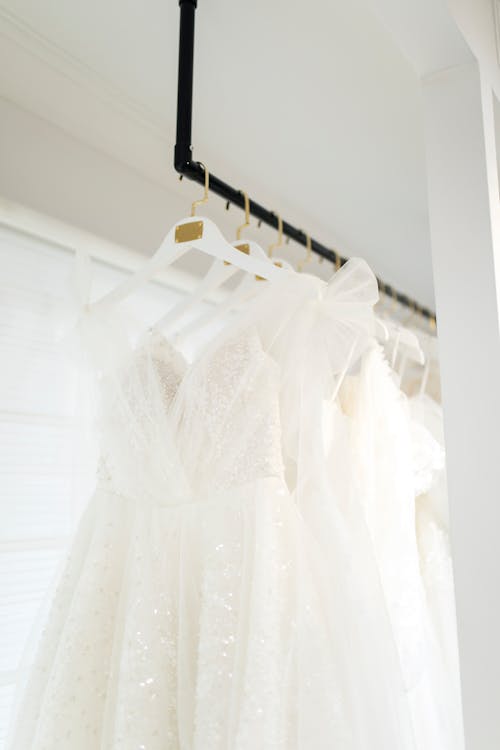Hanger of White Wedding Dresses