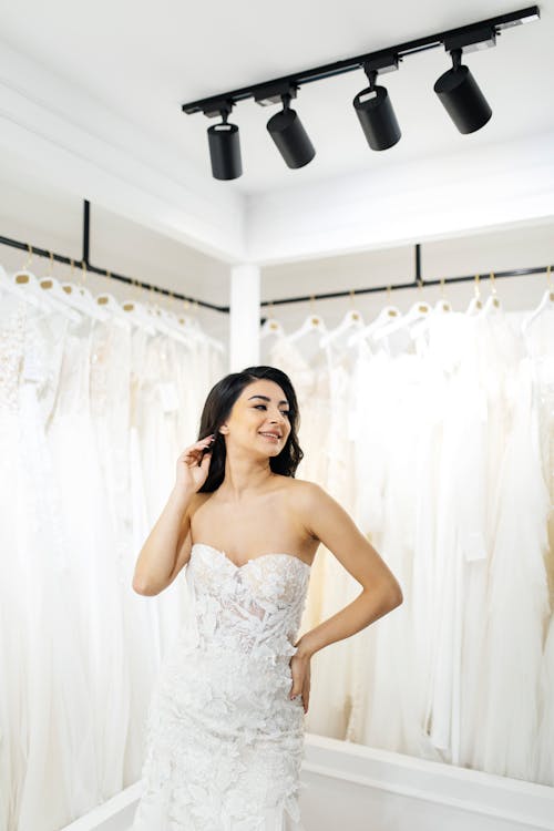 Smiling Model in Off-the-shoulder White Wedding Dress