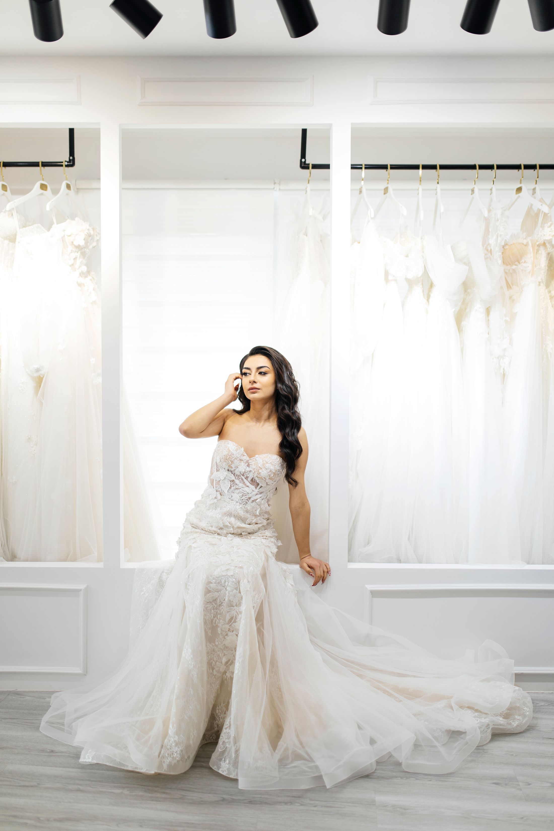 Bride wearing a couture wedding gown in a luminous salon