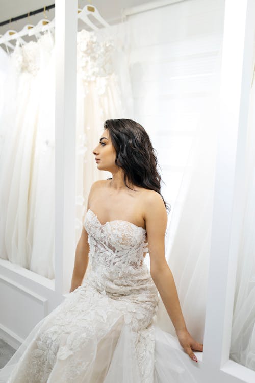 Brunette Bride Sitting in Wedding Dress