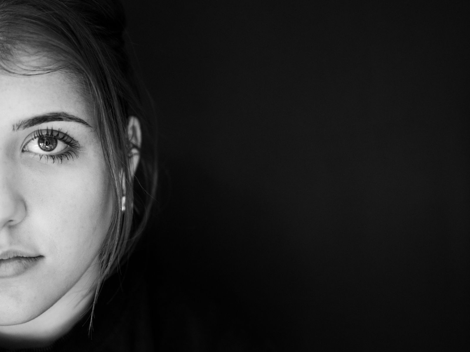 Playlist cover — half-face portrait against a dark ground. Photo by Pedro Lemos on Pexels