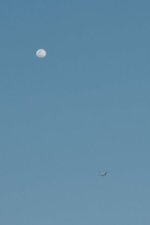 A plane flying over the moon