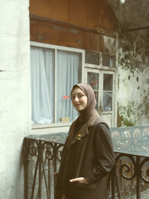 Smiling Woman in Hijab and Coat