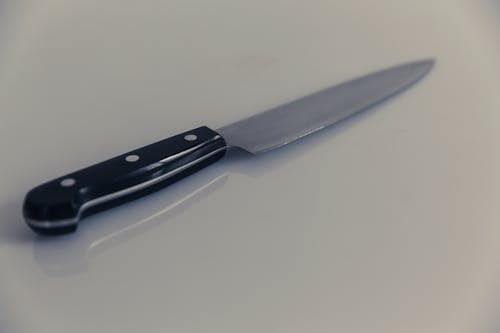 Black Handle Knife on White Table