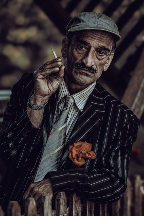 Elderly Man in Suit and with Cigarette