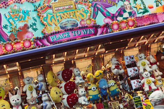 Vibrant carnival stall showcasing plush toys and colorful signage. Fun and engaging atmosphere.