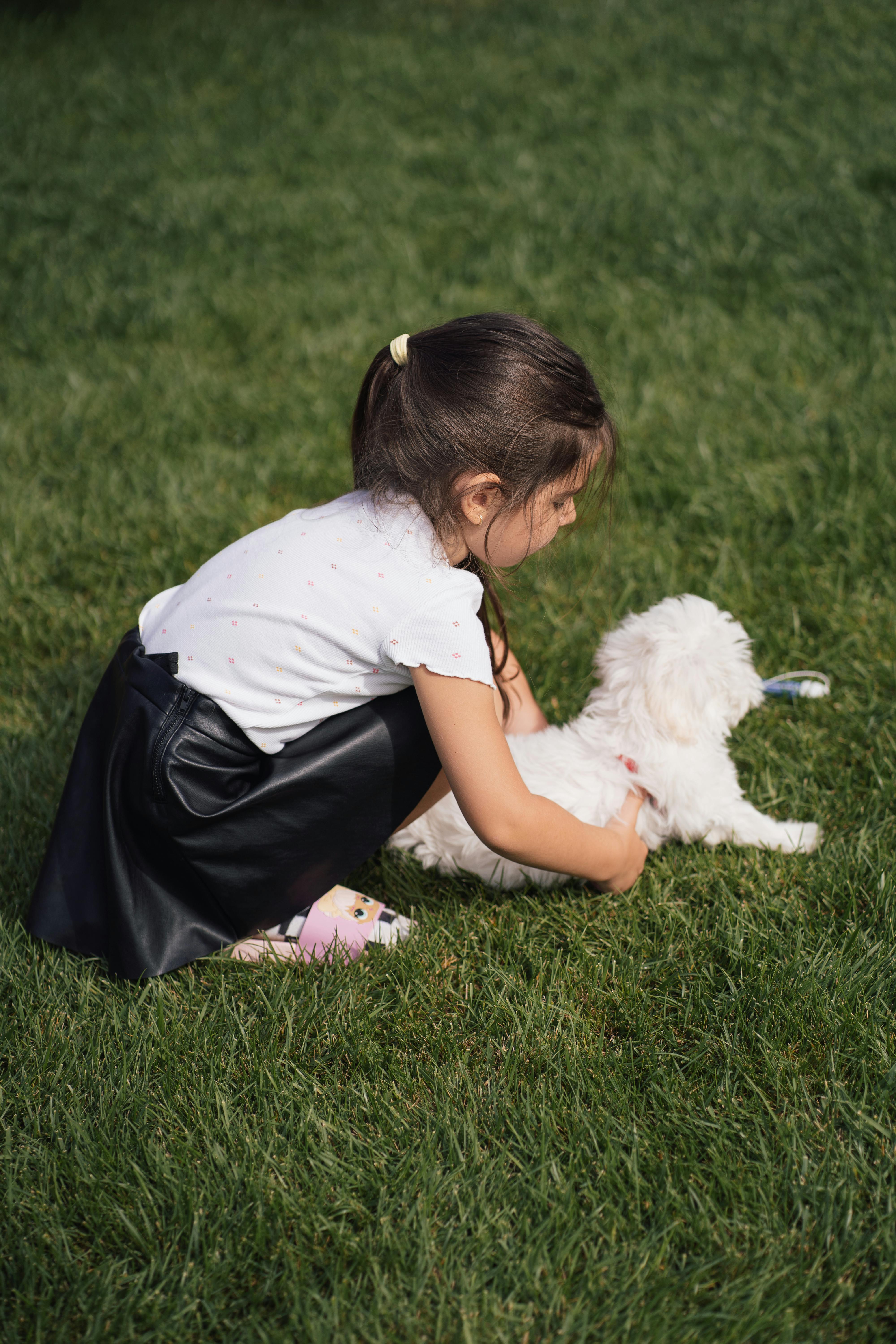 kid playing with dog