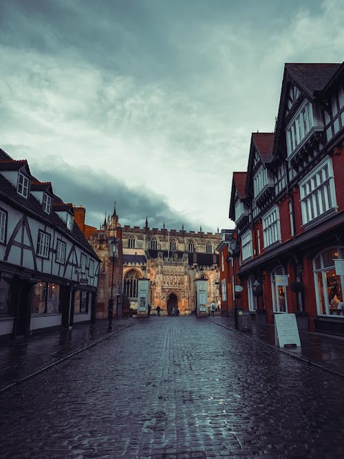 A photo of a cobblestone street with buildings