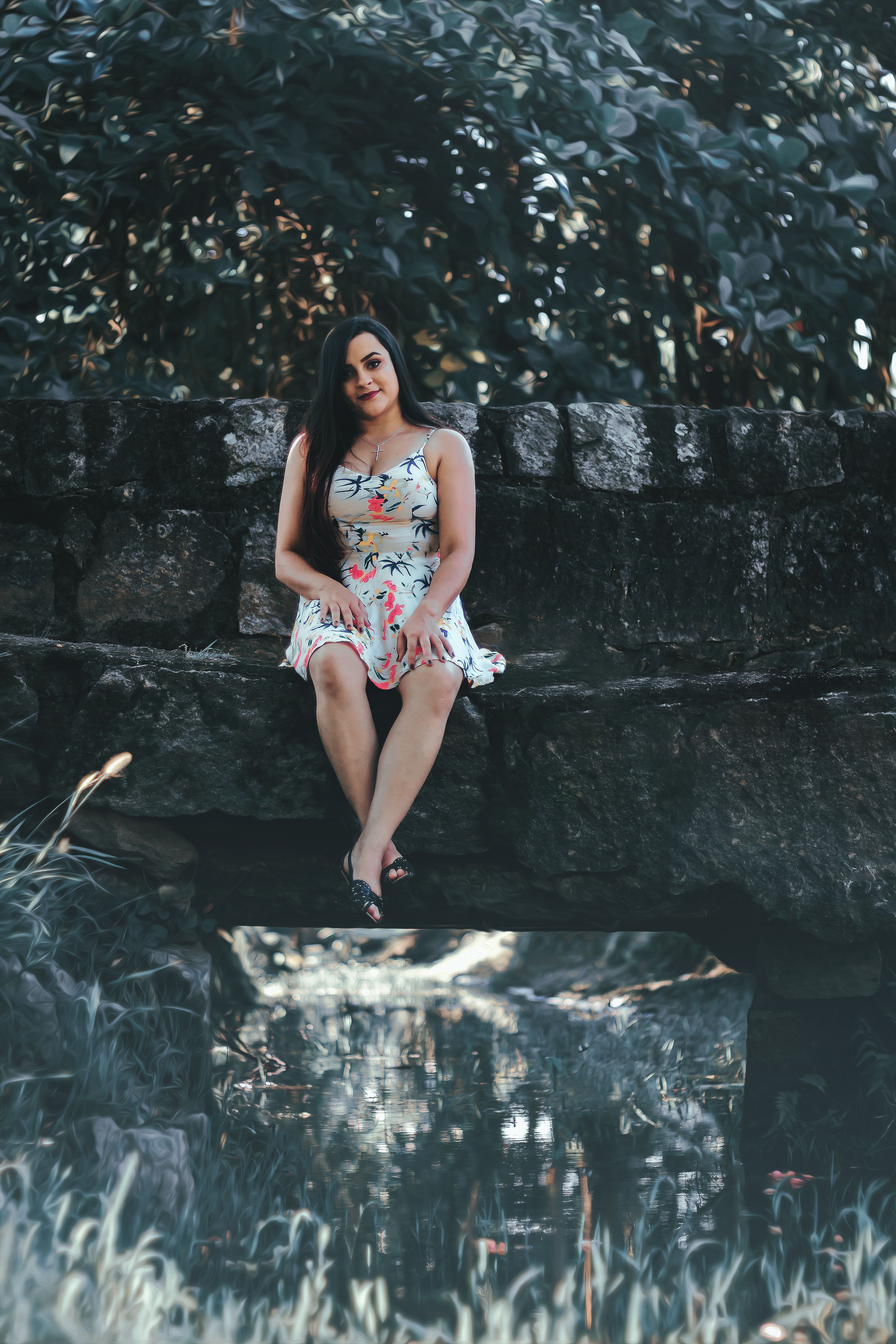 Woman Sitting on Ground While Holding Her Hair · Free Stock Photo
