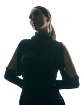 Artistic silhouette of a woman with dramatic lighting, conveying mystery.