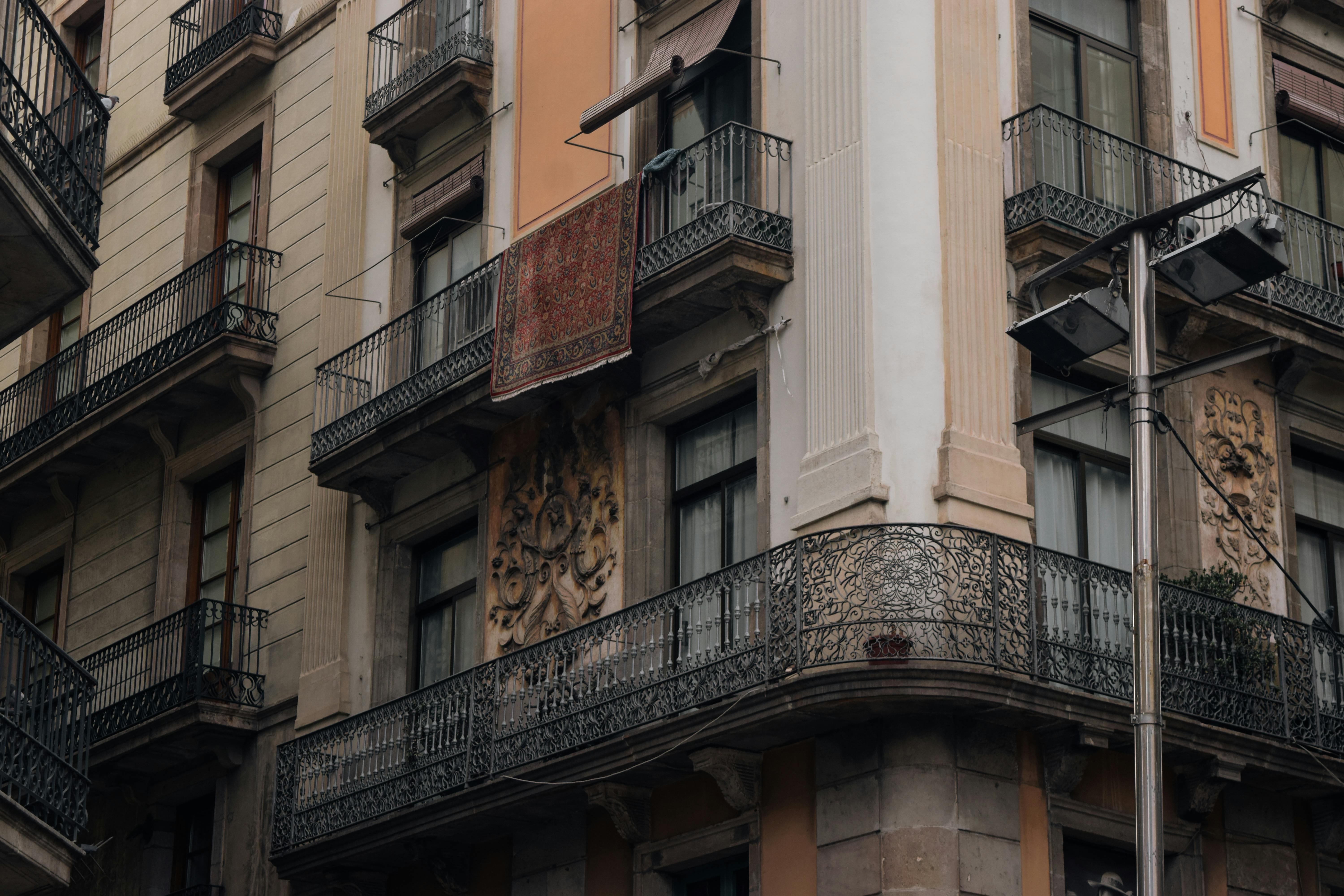 Close-up of ornate balconies on a historic residential building in Barcelona, Spain.