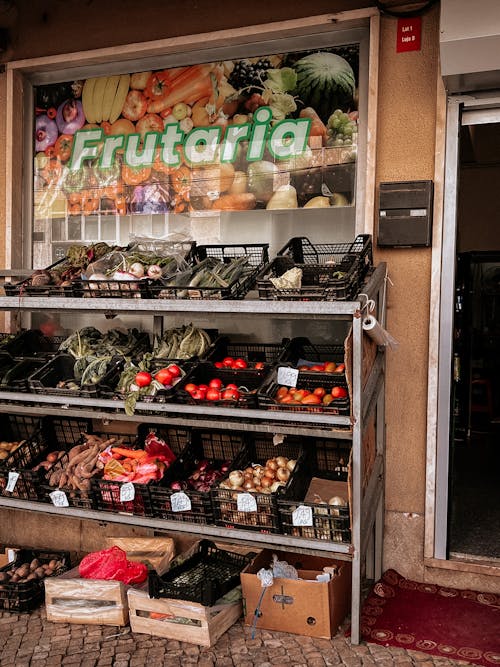 A fruit and vegetable store with a sign that says fruit and vegetables