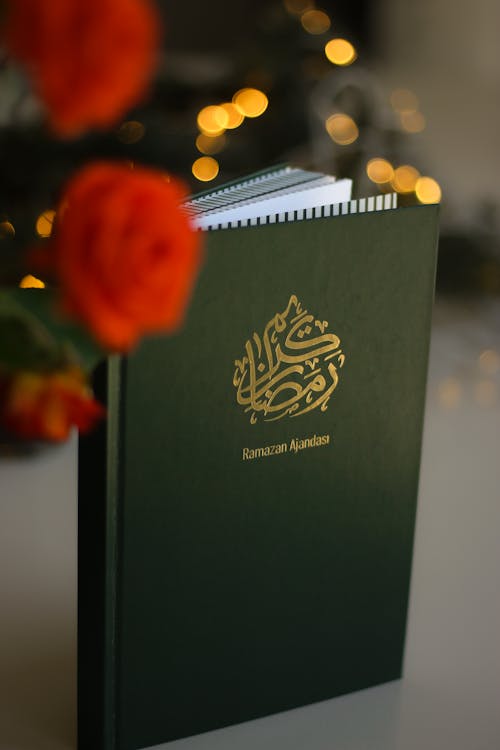 A green book with the words islamic on it