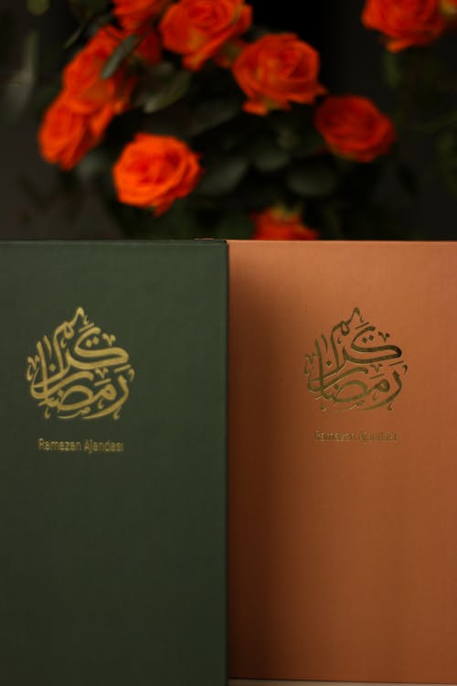 Two books with arabic writing on them