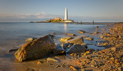 Rocky Coastline with St Marys Lighthouse in the Background