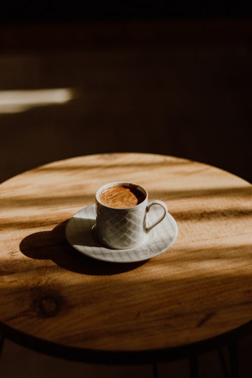 A cup of coffee on a wooden table