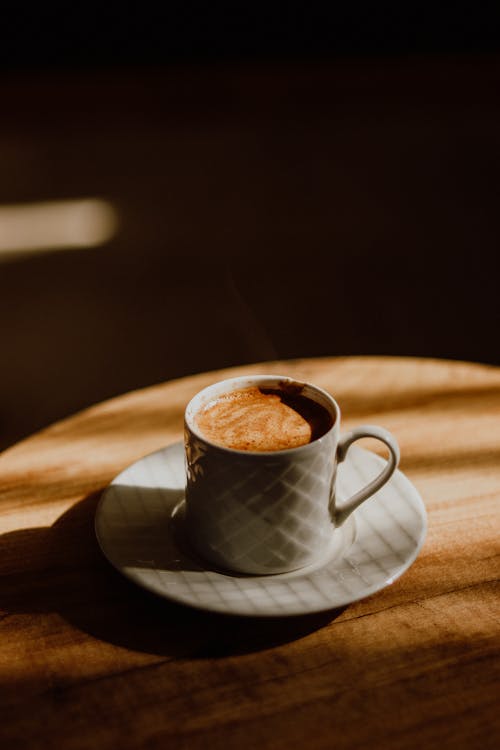 A cup of coffee on a wooden table