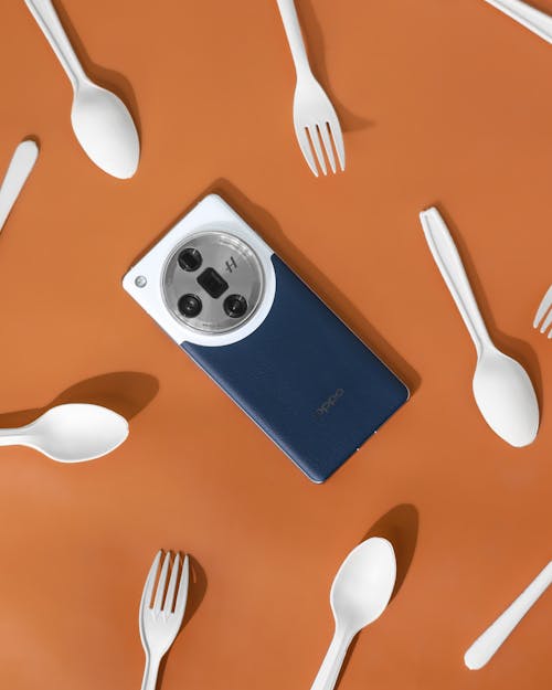 A blue phone with a fork and spoon on it