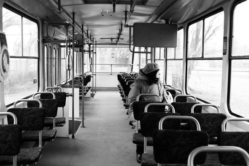 Free Black and white photo of a solitary passenger on a tram in Riga, Latvia. Stock Photo