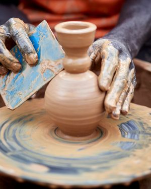 Hands shaping a pot on the wheel — Marafaphotos on Pexels