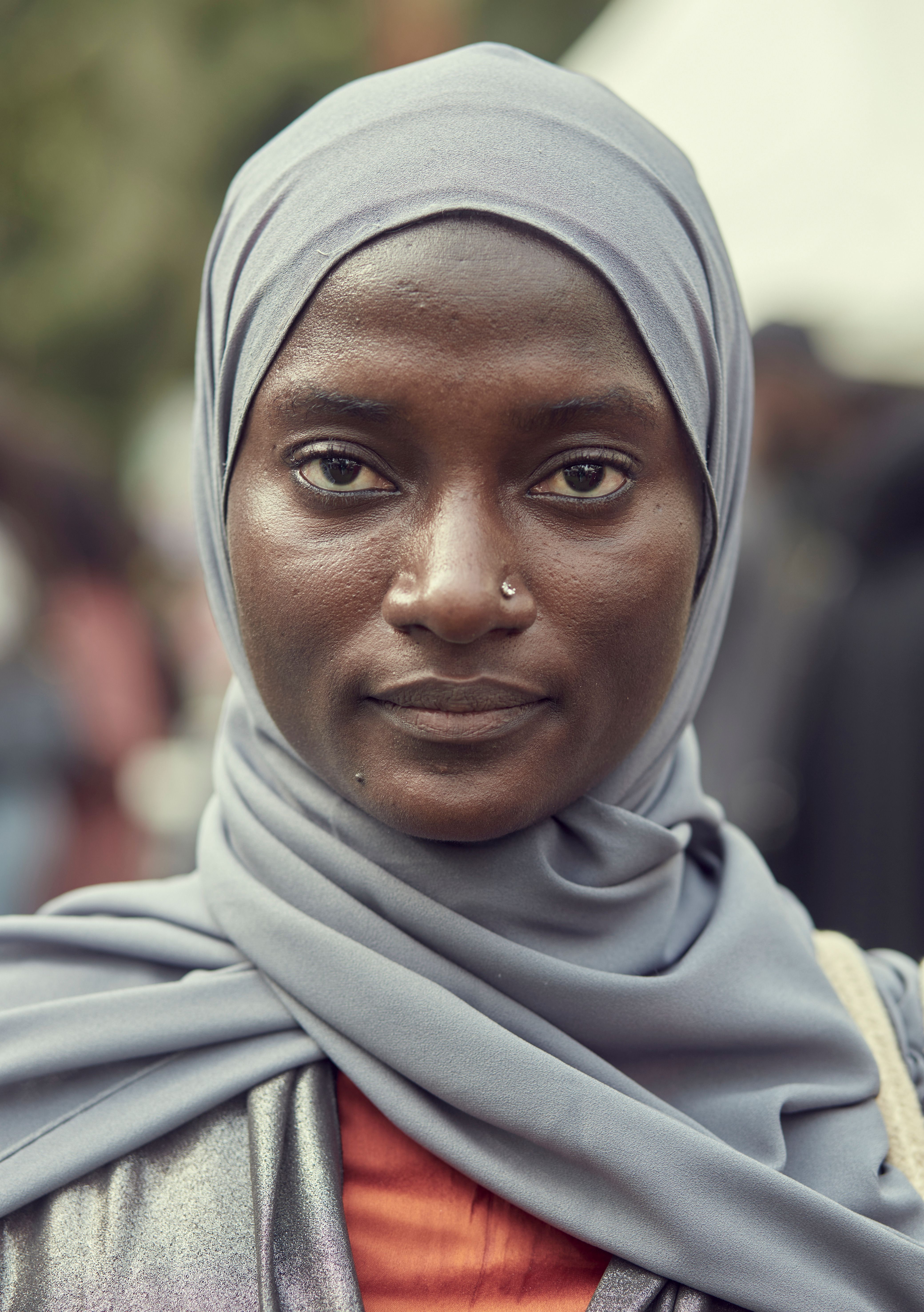 African Woman Holding a Headscarf · Free Stock Photo
