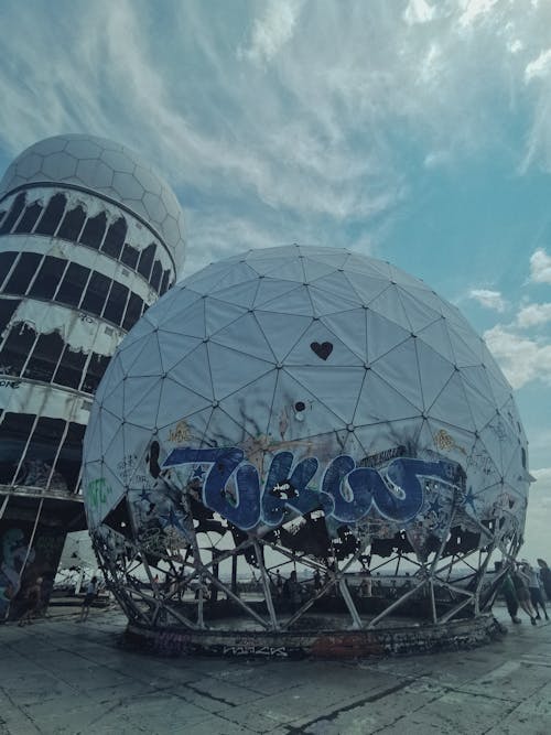 A large dome with graffiti on it