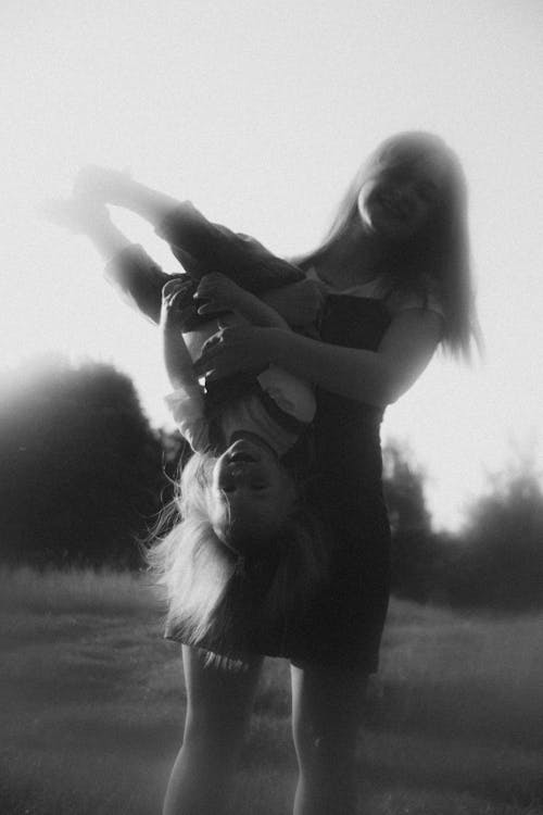 Woman with Daughter on a Field in Black and White 