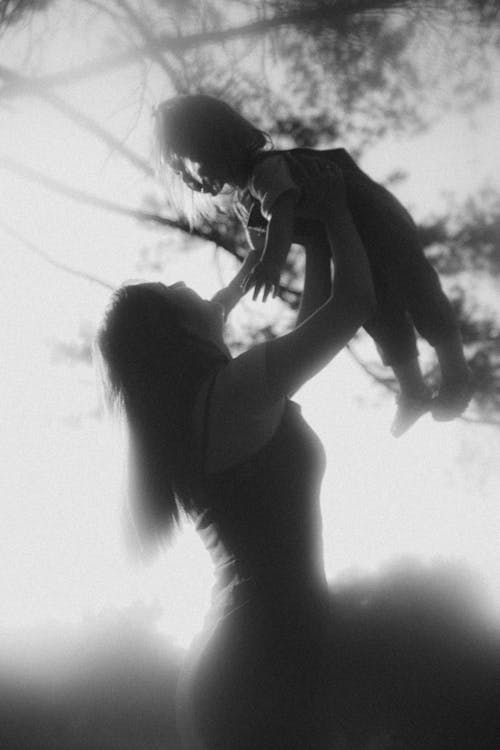 Mother Lifting Daughter in Black and White