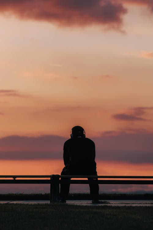 Silhouette of Sitting Man at Sunset