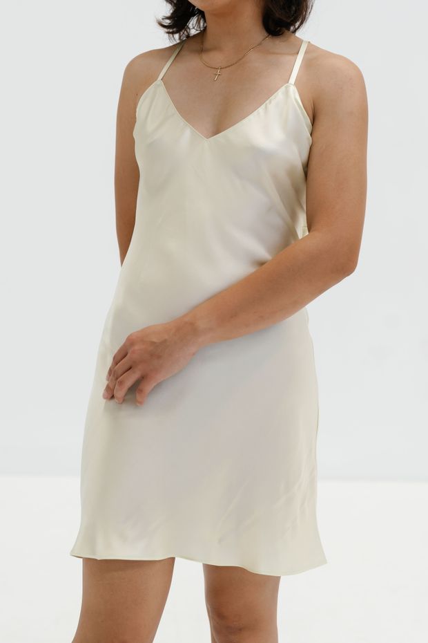 Bias-cut silk slip dress in ivory — photo by Sensory Soft on Pexels