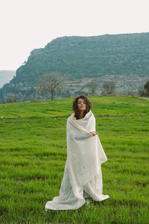 Free Woman in Blanket in Grassfield Stock Photo