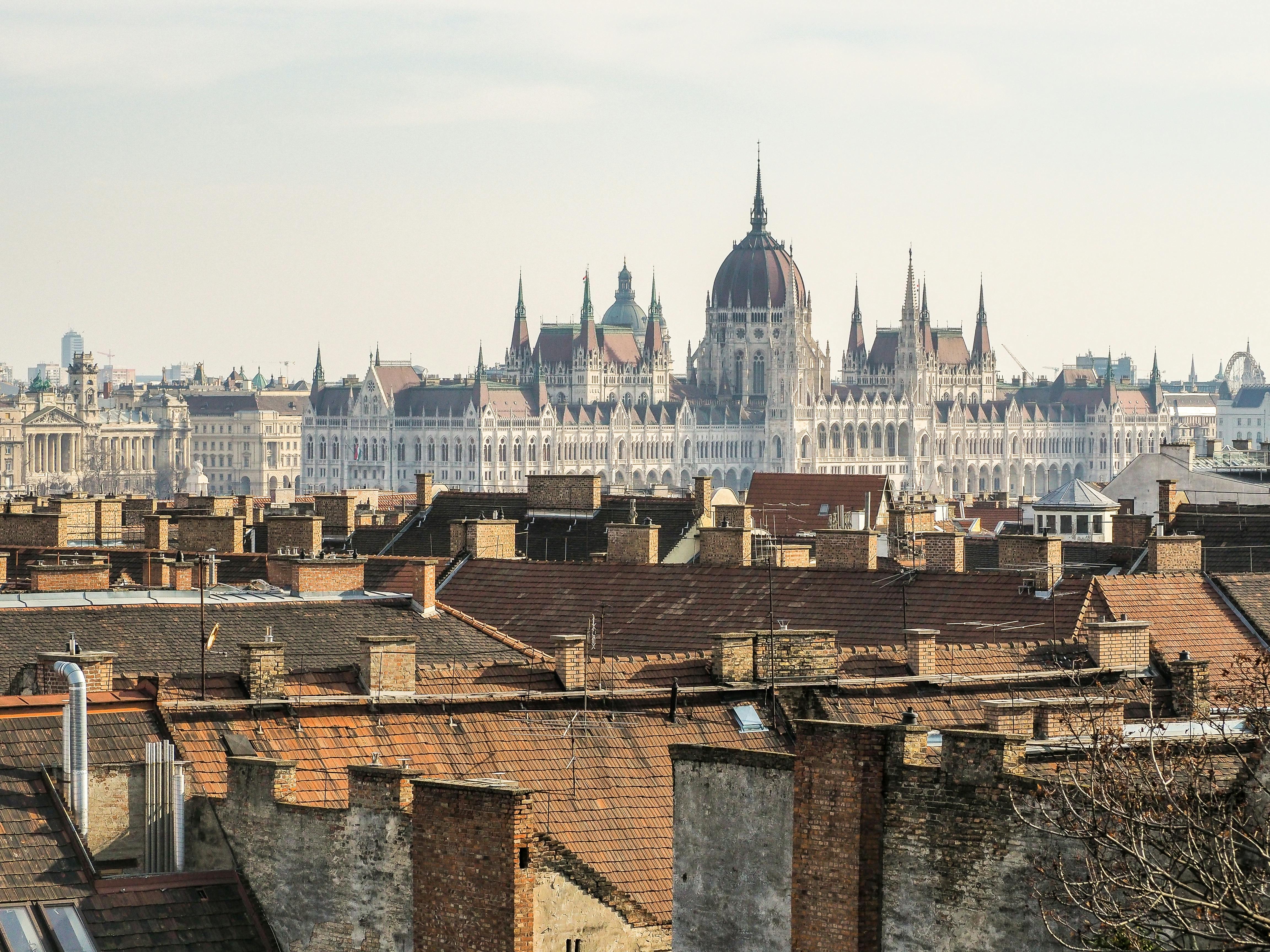 A stunning view of Budapest showcasing the Hungarian Parliament Building amidst city rooftops.