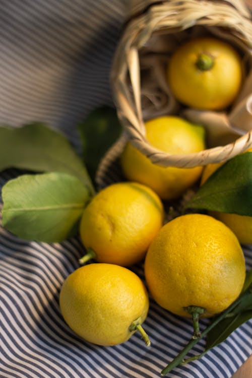 Close-up of Fresh Lemons Spilling Out of a Basket 