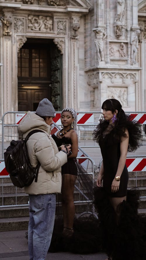 Photographer with Models in City