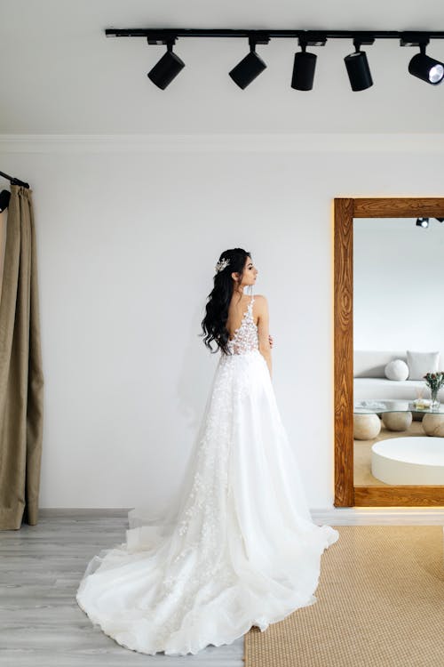 Woman in a Wedding Dress Posing in a Bridal Shop 