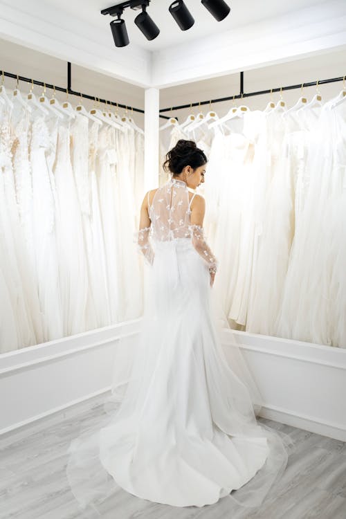 Woman in a Wedding Dress Posing in a Bridal Shop 