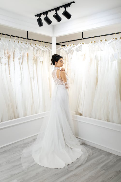 Woman in a Wedding Dress Posing in a Bridal Shop 