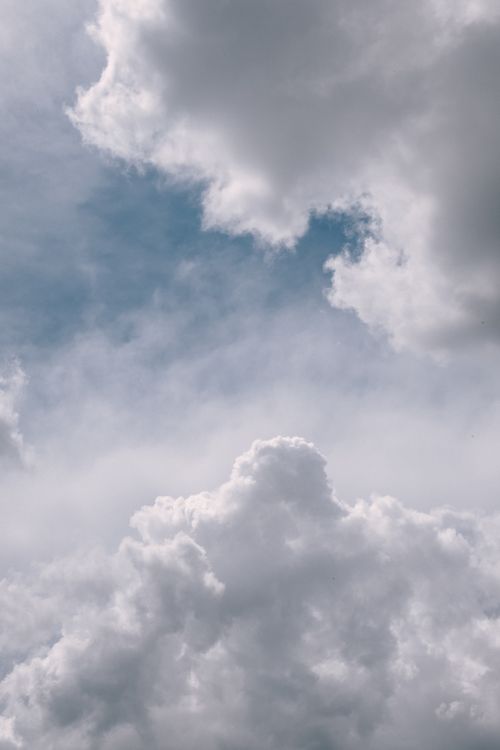 Free A cinematic view of thick, white clouds with a hint of blue sky, creating an ethereal, atmospheric scene. Stock Photo