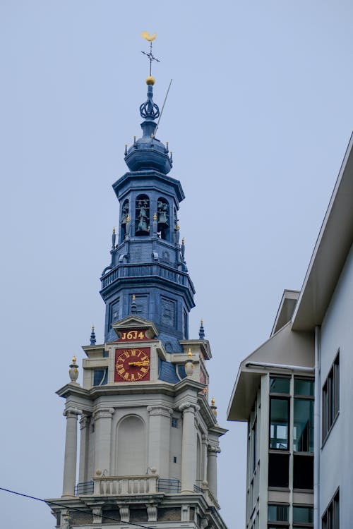 A clock tower with a blue and white clock