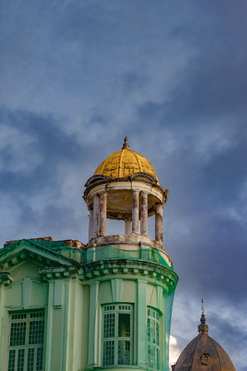 Gazebo on the Roof of a Building Covered with Green Mesh