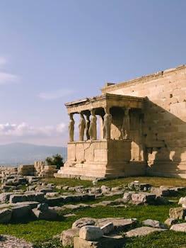 The Erechtheion with its iconic Caryatids in Athens, Greece, under summer sunlight.