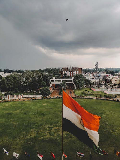 A view of the indian flag flying over a park