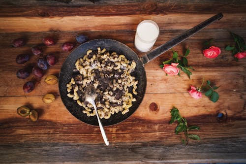 A skillet with food on it and a fork