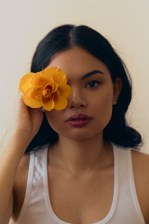 A woman with a flower in her eye