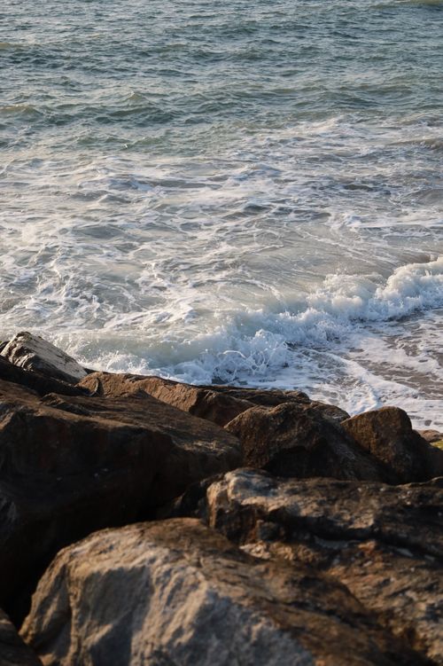 Free Tranquil waves crashing onto rugged rocks at Esposende's beautiful coastline in Portugal. Stock Photo