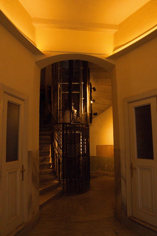 A spiral staircase leading to a room with a door